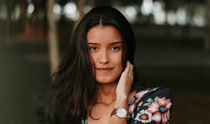 young woman looking into the camera smiling