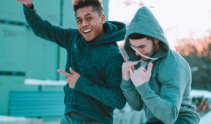 two men in hoodies
