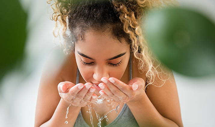 a women washing her face