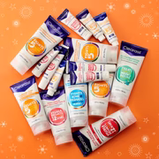 Flat lay of Clearasil product range on orange background